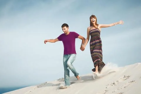 Couple running from mountain Stock Photos