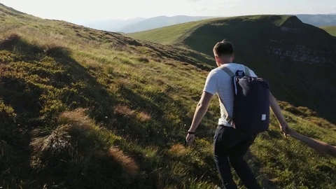 Couple running on the mountain range. Stock Footage 81279164