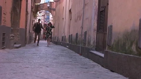 Couple running on the old streets Stock Footage 71914818