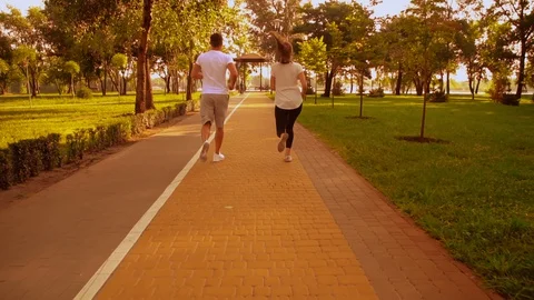 Couple running outdoors Stock Footage 129901516