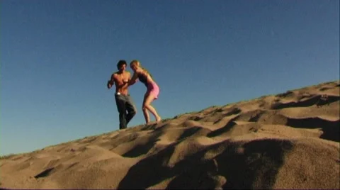 Couple running on sands Stock Footage 43688620