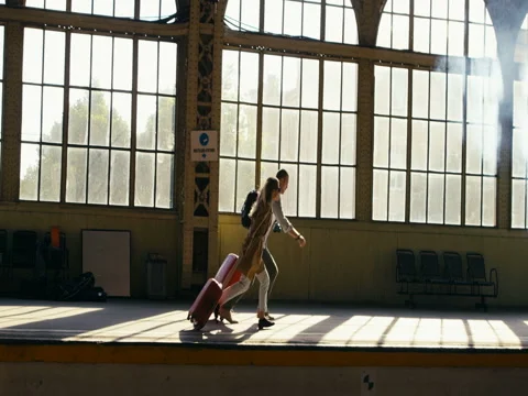 Couple Running At Station Video stock 78770397