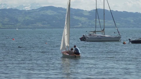 Couple sailing on the lake of constance Stock Footage 109049384