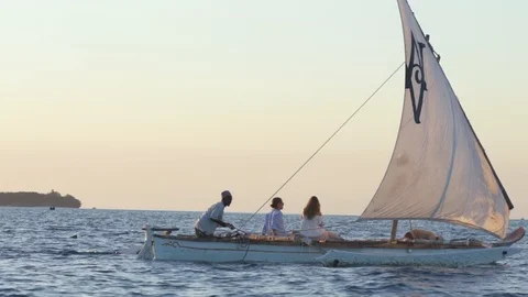 Couple sailing in the sailboat Stock Footage 85775603