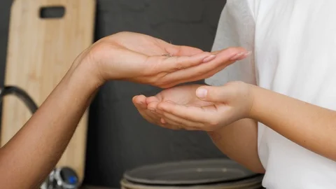Couple Sanitizing Hands Stock Footage 126719039