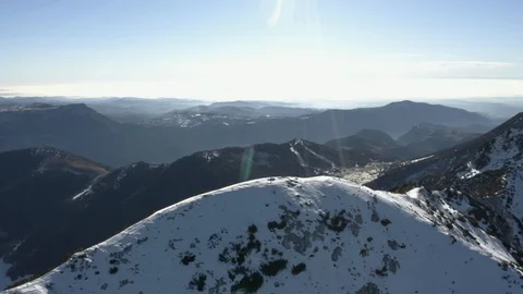 Couple sat on top of mountain peek, wide panorama. Monte Baldo Stock Footage 102494792