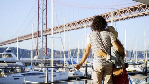 Couple on seafront in sunlight Stock Footage 105188705