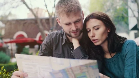 Couple searching on map Stock Footage 74746714