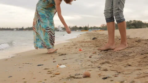 Couple Searching For Sea Shells Video stock 26177143