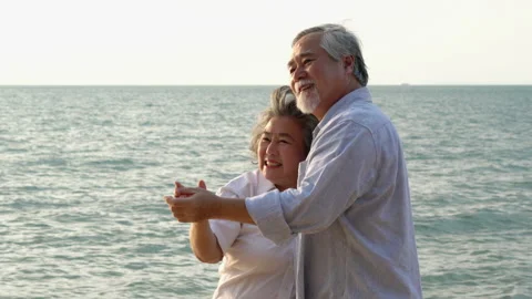 Couple senior dancing on the beach Stock Footage 183974069