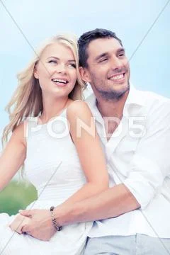 Couple in shades at sea side Stock Photos