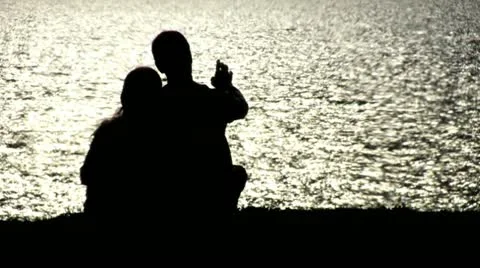 Couple Shadow next to Ocean 2 Stock Footage 10898338
