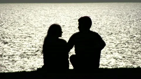 Couple Shadow next to Ocean 5 Stock Footage 10898509