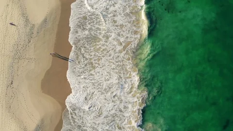 Couple With Shadows Walking On Beach Stock Footage 123814217