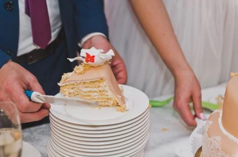 The couple shared a wedding cake for serving guests 9281. Stock Photos