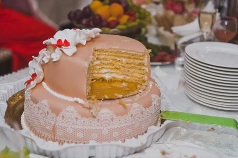 The couple shared a wedding cake for serving guests 9282. Stock Photos