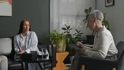 Couple Sharing Feelings while Therapist Assisting Spouses during Family Therapy Stock Footage 312466845