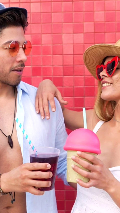 Couple sharing refreshments on a summer day Stock Footage 310185597