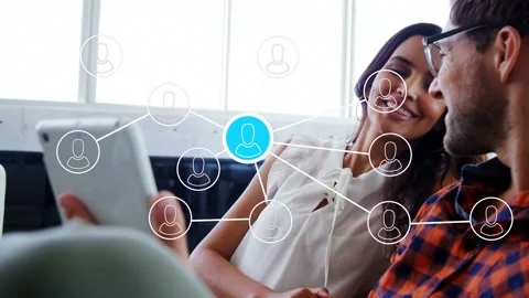 Couple sharing tablet while tech overlay emerging, animating nodes, fading to Stock Footage 336714237