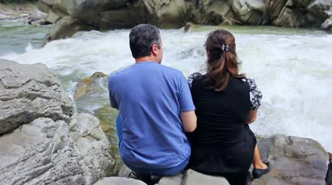 Couple On Shores Of River Stock Footage 11882146