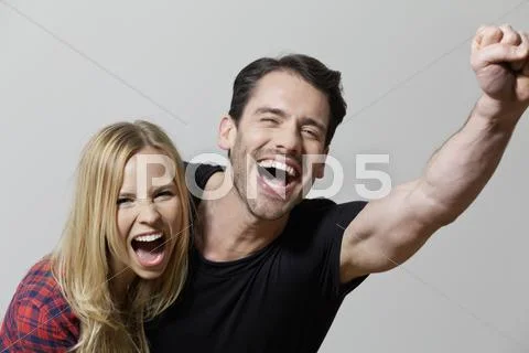 Couple shouting against white background, close up Stock Photos
