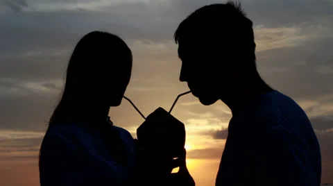 Couple silhouette at the beach. Sunset light. Stock Footage