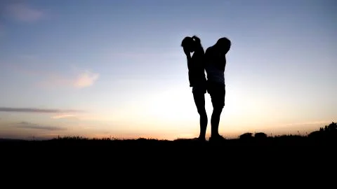 Couple silhouette breaking up a relation Foto stock