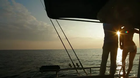 Couple Silhouette on Yacht at Sunset Stock Footage