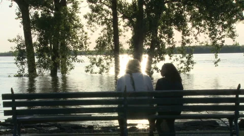 Couple sits on bench 스톡 동영상 4958921