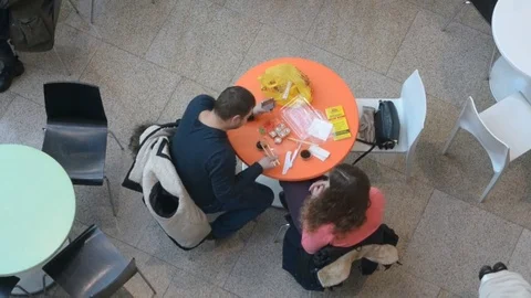 Couple sits at small round tables in Ocean Plaza mall Video stock 71468123