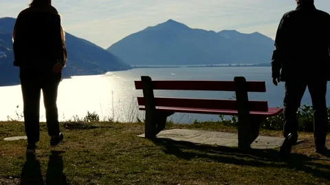 Couple Sitting and Hugging on a Bench with Mountain View Stock Footage 194011862