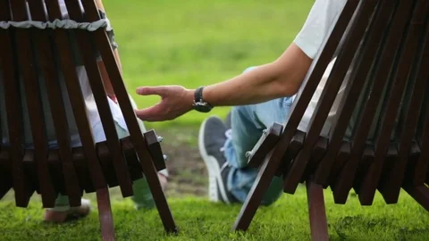 Couple sitting in the back yard of a country house Stock Footage 82017503