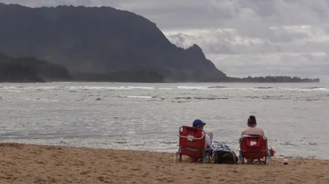 Couple sitting on the beach Stock Footage 35217144