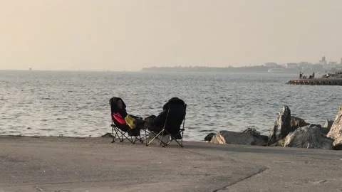 Couple sitting on the beach Video stock 144337709