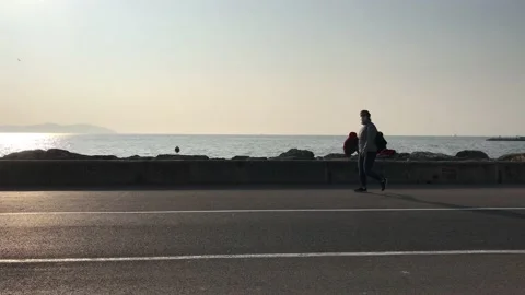 Couple sitting on the beach Stock Footage 144343873