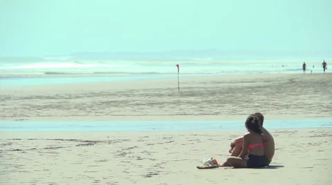 Couple Sitting on Beach Sand Stock Footage 48918224