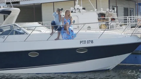  A Couple is Sitting on a Boat Stock Footage 87971509
