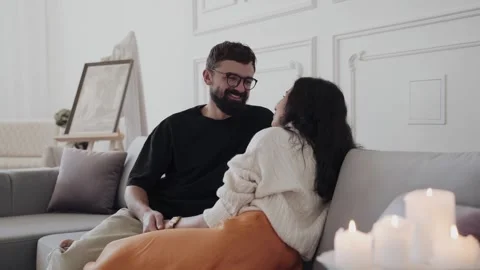 Couple sitting on couch at home Stock Footage 265282485