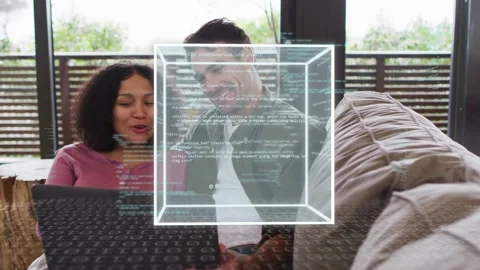 Couple sitting couch viewing laptop, cube appearing with code streams, man Stock Footage 333445913