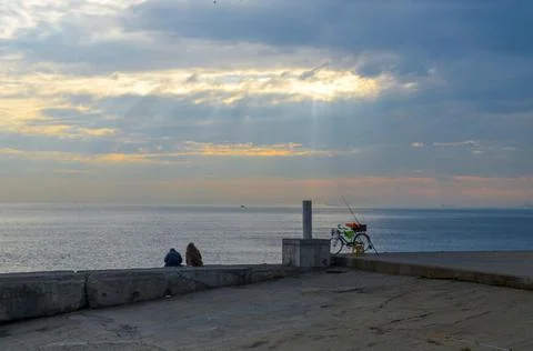 Couple sitting on the Istanbul coast Stock Photos