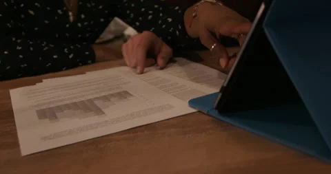 Couple sitting in kitchen with tablet and plans Stock Footage 193499752