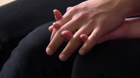 Couple Sitting Next to Each Other holding Hands Stock Footage 48712186