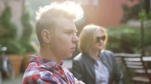 Couple sitting outside and having an argument with each other Stock Footage 56246842