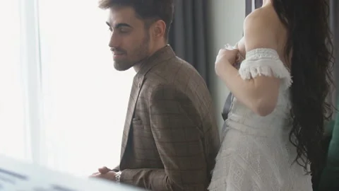 Couple sitting on the sofa Stock Footage 147684228