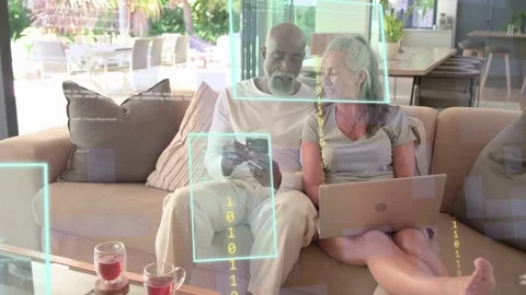 Couple sitting on sofa man tapping phone holding card UI showing code over Stock Footage 333936818
