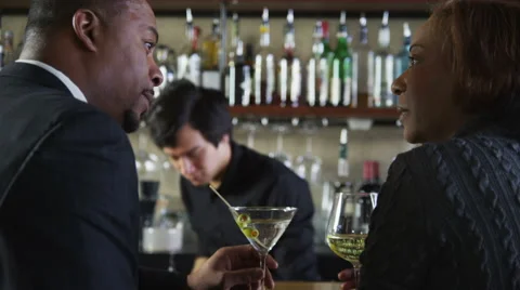 Couple sitting together at bar talking Stock-Footage 62282880