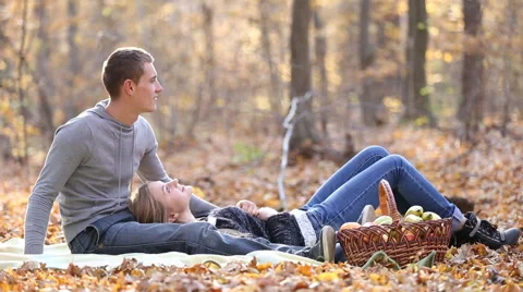 Couple sitting in the woods Stock Footage 58698339