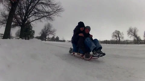 Couple Sledding Stock Footage 32420460
