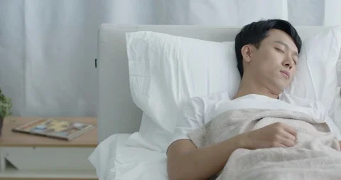 The couple is sleeping in bed Stock Footage 100937356