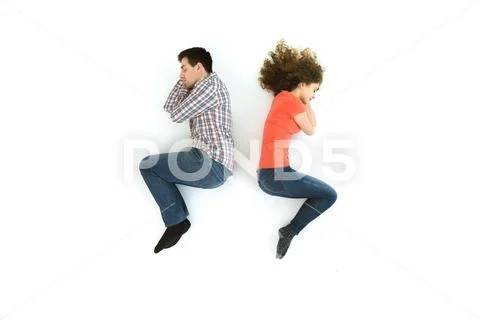 The couple sleeping on the white floor. View from above Stock Photos
